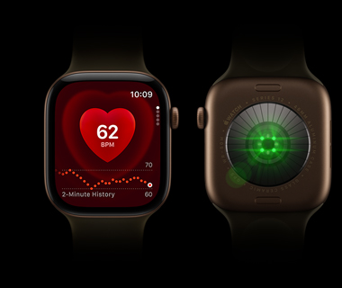 Two Apple Watch Series 12 devices side by side; Front-view of Apple Watch Series on left, screen displays heart rate monitor; Back-view of Apple Watch Series 12 on right, lights shine bright, color green