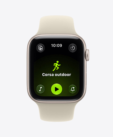 Apple Watch SE 3, aluminum case, starlight color, screen shows Workout app (outdoor run), right side exterior, Digital Crown dial, Sport Band, sand color (light tan)