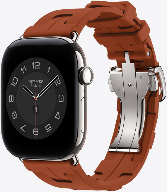 銀色鈦金屬錶殼 Apple Watch Hermès Series 12,採用 Circulaire 指針錶面 (小時、分鐘與秒針,以及多項複雜功能,包括天氣、噪音、活動記錄圓圈與巴黎時間),右側外觀上有數位錶冠、麥克風、側邊按鈕,搭配 Cuivre 銅綠色 (棕色系) Kilim Single Tour 錶帶,錶帶由橡膠材質模塑成型,搭配幾何結構相扣的設計與銀色金屬錶釦