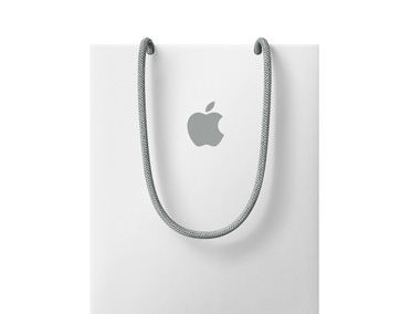 Shopping bag bianca con logo Apple verso il bordo superiore
