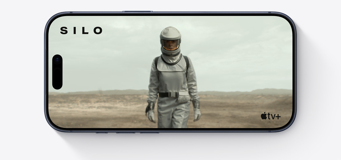 iPhone priekšpuse, horizontāli, Apple TV klips ar cilvēku skafandrā, Silo
